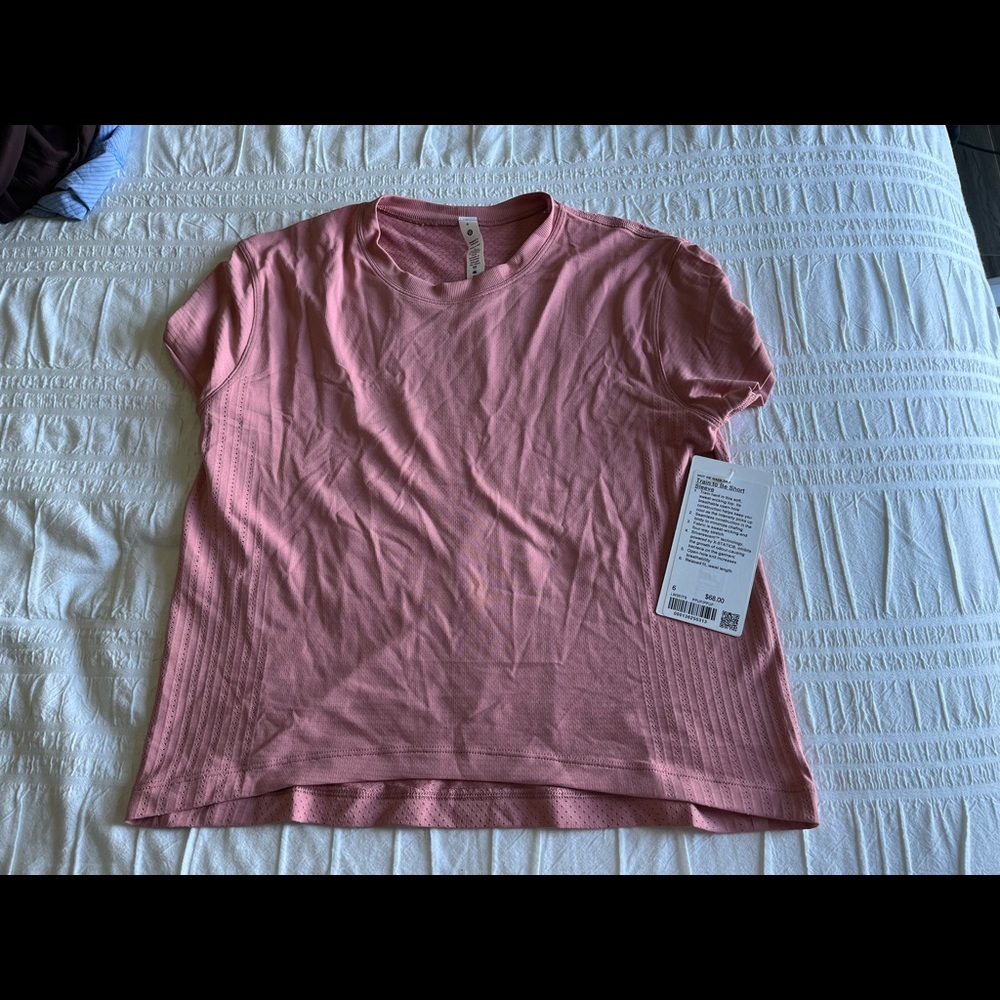 Train to be lululemon pink shirt